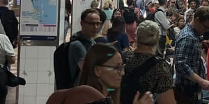 People crowd the platform at Central Station after lightning caused a signal fault and created commuter chaos in Brisbane on Thursday.