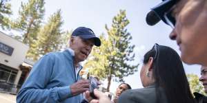 US President Joe Biden talks with reporters after taking a pilates and spin class in Lake Tahoe,California.