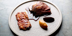 Roasted Margra lamb rump is served with crisped belly,pumpkin miso and black garlic.