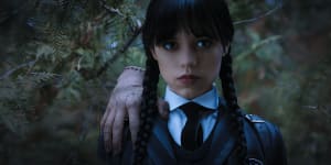 Thing and Jenna Ortega as Wednesday in Tim Burton’s Addams Family reboot.