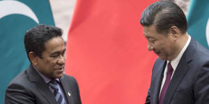 Maldives President Abdulla Yameen,left,shakes hands with China's President Xi Jinping in Beijing.