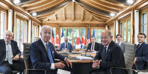 British Prime Minister Boris Johnson (left) mocked Russian President Vladimir Putin as the G7 leaders sat down to meet on Sunday. Also pictured are (left to right) European Commission President Ursula von der Leyen,US President Joe Biden,European Council President Charles Michel,Italian Prime Minister Mario Draghi,German Chancellor Olaf Scholz,Canadian Prime Minister Justin Trudeau and French President Emmanuel Macron.