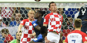 Croatia's Mario Mandzukic scores at the wrong end.