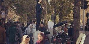 Women in Iran have been protesting against laws forcing them to wear veils by posting pictures on social media holding their headscarves high.