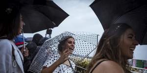 Downpour dampens Derby Day punters and anti-racing protests