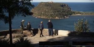 Soaring views:Visitors at West Head,in the Ku-Ring-Gai Chase National Park,look eastwards towards the Barrenjoey Lighthouse on Wednesday.