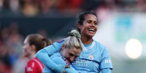 Mary Fowler celebrates with Laura Coombs after scoring the opener for Manchester City at Ashton Gate.