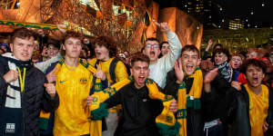 Socceroos fans go wild in Federation Square,Melbourne.