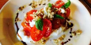 Baby tomatoes,mozzarella,granola and balsamic.