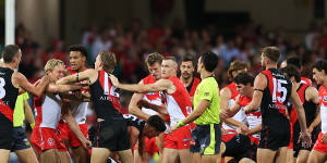 Swans and Bombers players scuffle after the incident involving Peter Wright and Harry Cunningham.
