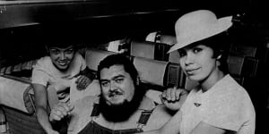 “When American wrestler Haystack Calhoun left Sydney today for Hong Kong,it took two hostess and two normal airline seats to fit him into Philippine Airlines DC8 jet. The hostesses are Teresita Fernandez,28,and Dolores Gomez,28,of Manila. December 7,1971.”