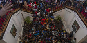 People throng then-president Gotabaya Rajapaksa’s official residence in Colombo,Sri Lanka,on July 11,a day after it was stormed by protesters demanding his resignation amid the country’s worst economic crisis in recent memory. 