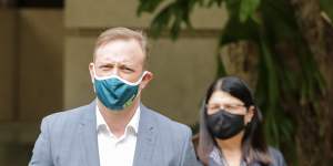 Masks are again mandatory indoors in Queensland as cases accelerate