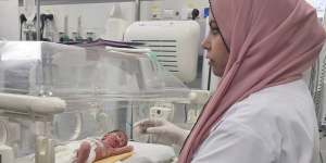 Palestinian baby girl,Sabreen Jouda,who was delivered prematurely after her mother was killed in an Israeli strike,receives treatment in the Emirati hospital in Rafah,southern Gaza Strip,last Sunday.