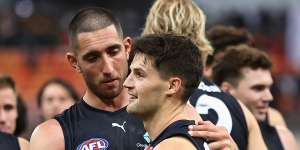 Jacob Weitering congratulates Nic Newman (right) after Saturday’s win over the Giants.