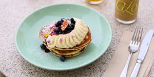 Cali pancake stack with banana,blueberries and maple syrup.