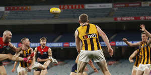 Max Gawn gets a kick away for the Demons in their draw with Hawthorn at a crowdless MCG.