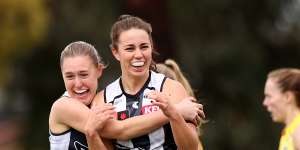 Chloe Molloy celebrates a goal for the Pies.