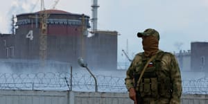 A Russian soldier stands guard at the Ukrainian Zaporizhzhia nuclear power plant.