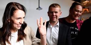 Jacinda Ardern waves to supporters at an Auckland cafe on Sunday morning,after her election victory.
