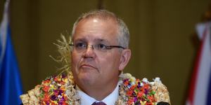 Prime Minister Scott Morrison,pictured in Fiji last year. Australia has kept all essential personnel in the South Pacific and its posts remain open.
