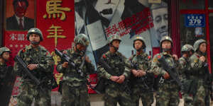 Armed police patrol the streets in Urumqi,Xinjiang,China.