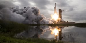 Private companies – like SpaceX,whose Falcon Heavy rocket is pictured carrying a satellite – have entered the space race.