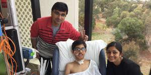 Soham Patel at the Royal Children’s Hospital,with father Nikunj and mother Priyam,recovering from encephalitis in 2018.