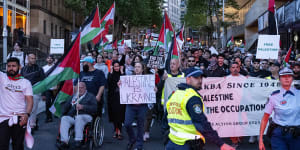 Pro-Palestinian protesters march through Sydney on Monday. Activists will defy warnings from NSW Police and rally again in Sydney’s Hyde Park on the weekend.