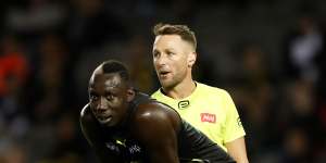 Umpire Brett Rosebury looks on as Mabior Chol of the Tigers mans the mark against Collingwood last week.