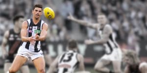 Scott Pendlebury disposes of the ball in round six against Essendon. 