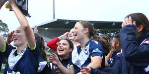 Melbourne Victory players celebrate after their A-League Women’s grand final triumph.
