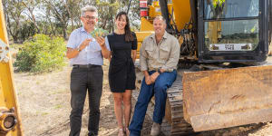 Royal Canberra Show chief executive Athol Chalmers launches the'Dueling Excavators'competition with sponsors Yukari and Lee Carmody,of Drive This Canberra. The competition is part of a new-look main arena program at this year's Show.