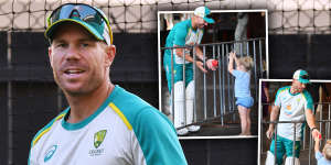 David Warner plays with his daughters before a net session at Adelaide Oval. 