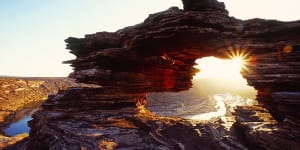 Rock stars ... sunset over the dramatic Nature's Window formation in the Kalbarri National Park.