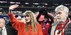 Taylor Swift walks with Ed Kelce after watching the Kansas City Chiefs defeat the Baltimore Ravens in January.