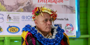 Tuvaluan Finance and Climate Change Minister Seve Paeniu is welcomed to the Kioa meeting in a traditional ceremony. 