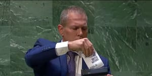 Israel’s UN ambassador Gilad Erdan theatrically inserted a miniature copy of the UN charter into a transparent paper shredder.