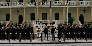 More than 60 people attended the rally,which was monitored by uniformed police.