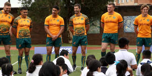 Wallabies (from right) Lachie Swinton,Izaia Perese,Lalakai Foketi,Jake Gordon,Angus Bell and Michael Hooper at a jersey launch at St Johns Primary School,Auburn.