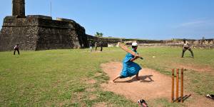 Boys playing cricket near Galle Fort,Sri Lanka.