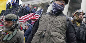 Members of the Oath Keepers stand on the East Front of the US Capitol on January 6,2021.