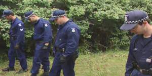 Officers search bushland in the Dandenong Ranges area in 1998 as part of Operation Collier.