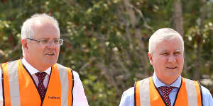 Prime Minister Scott Morrison and his deputy Michael McCormack in Brisbane. The PM says the extra infrastructure spending will deliver long term benefits.