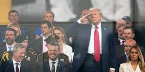 President Donald Trump salutes the military parade commemorating the US Army’s 250th anniversary (coinciding with his 79th birthday). Also pictured,from left,are,Secretary of the Army Daniel Driscoll,Defence Secretary Pete Hegseth and First Lady Melania Trump.