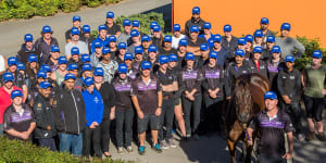 Time to say goodbye:Winx with the staff at Chris Waller's stable on Thursday.