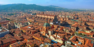 Bologna skyline with landmarks San Petronio church and Piazza Maggiore. cr:iStock (downloaded for use in Traveller,no syndication,reuse permitted)Â Cover Sunday October 16 Europe Brian Johnson SunOct16EuropeCover
