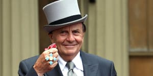 The late Barry Humphries pictured with his OBE in 2007.