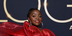 Suzan Mutesi on the Logies red carpet in her striking red gown which was custom-made by an African designer. 