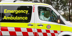 An ambulance drives out of the Anglicare Newmarch House at Caddens in Sydney's west.